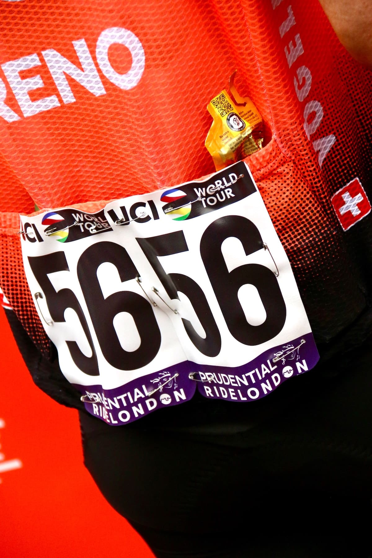 A energy gel in the back of a red cycling jersey - an example of on-ride nutrition for cycling.